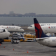 Delta Airlines passenger aircrafts are seen on the tarmac of John F. Kennedy International Airpot in New York, on December 24, 2021.